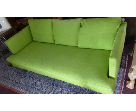 A contemporary Ligne Roset three seater sofa with lime green upholstery on chrome supports 