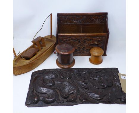 An early 19th century carved oak panel, together with an early 20th century oak desk tidy, two walnut containers and a vintag