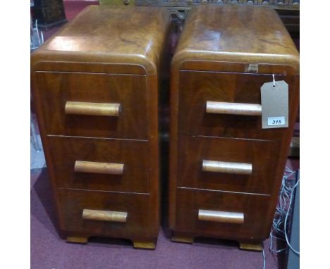A pair of Art Deco walnut bedside chests with three drawers on bracket supports (2) 