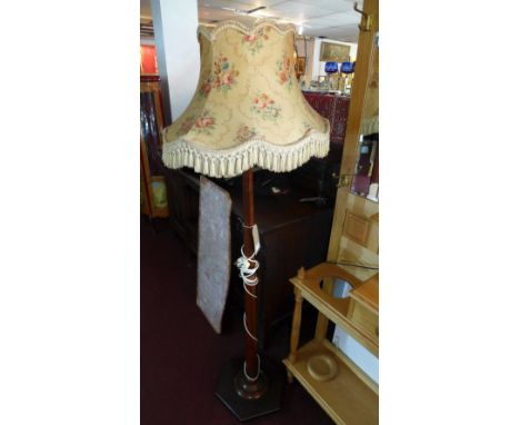 A 1940's mahogany standard lamp 