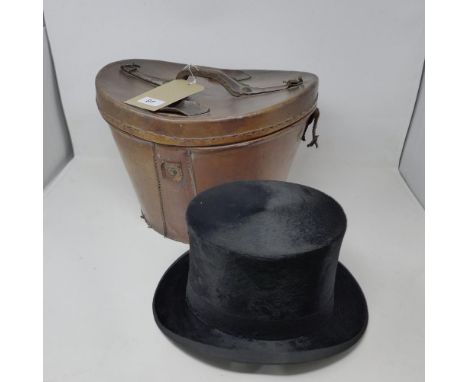 A vintage top hat in original leather box 