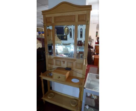 A contemporary light oak hall stand 
