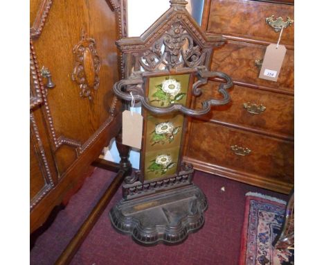 A Victorian cast iron stick stand, with tiled back, H.83 W.44 D.21cm 