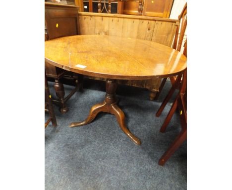 A GEORGIAN OAK TRIPOD TABLE