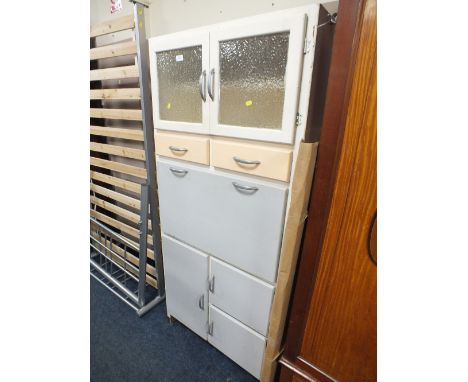 A VINTAGE KITCHEN CABINET WITH DROP DOWN ENAMEL FRONT