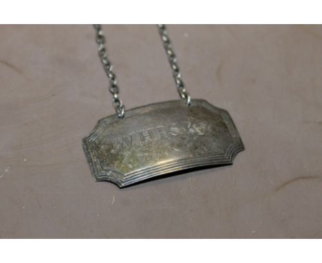 A HALLMARKED SILVER WHISKEY DECANTER LABEL 