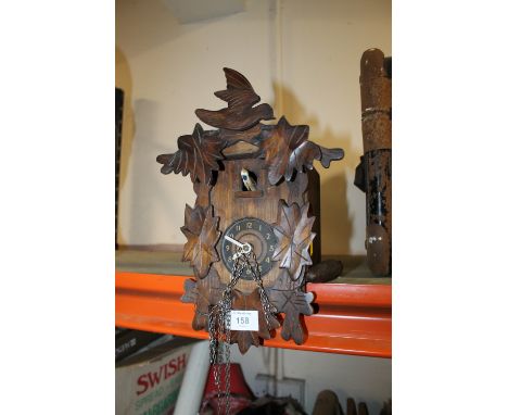 A EAICO CARVED CUCKOO CLOCK