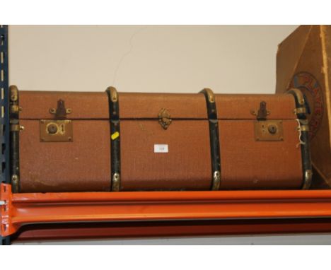 A LARGE BROWN VINTAGE TRUNK