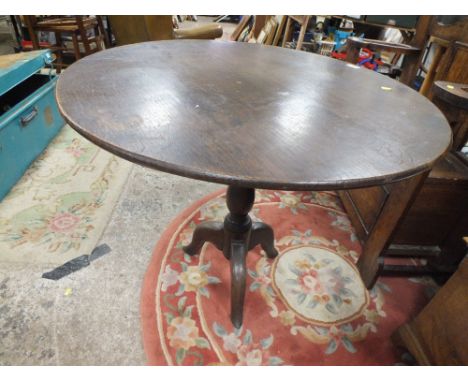 A 19TH CENTURY OAK TRIPOD PEDESTAL TABLE