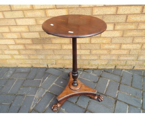 A mahogany bedside table with tripod support claw feet, approximate height 75 cm. Estimate £20 - £30