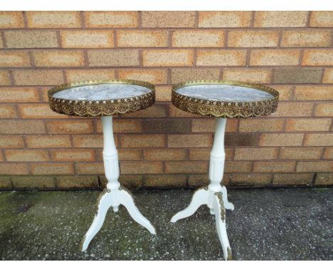 A pair of painted mahogany French ormolu mounted tripod wine tables having marble insert tops, approx 58cm x 34cm (diam) Est 