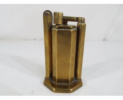 A World War Two (WWII) era Trench Art table lighter, marked to the base R Doulton Lostock, approx 8cm (h)