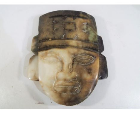 A carved jade stone wall plaque depicting a Mayan figure, 17.5 cm x 13.5 cm