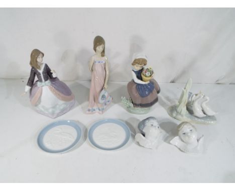 Lladro - Seven pieces by Lladro to include 5647 'Sara', 5211 'Angela' (missing parasol), a girl carrying a flower pot, two sm