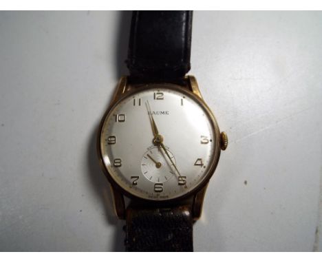 A gentleman's gold plated manual wind wristwatch by Baume & Co. on a leather band and in its original presentation box with s