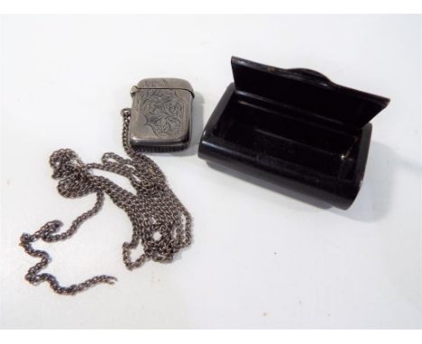 A hallmarked silver vesta, Birmingham assay 1903 and an ebony snuff box with hinged lid [2]