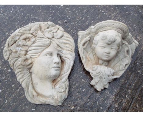 A wall mounted stone planter in the form of a cherub's face and a wall mounted plaque depicting a lady's face (2) Est £10 - £