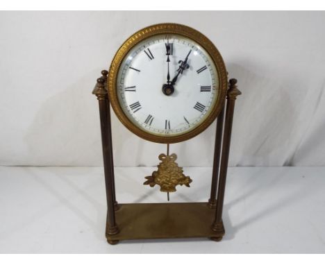 A brass cased portico styled mantel clock, white enamel dial with Roman numerals, blued steel fleur-de-lys hand, pendulum bob