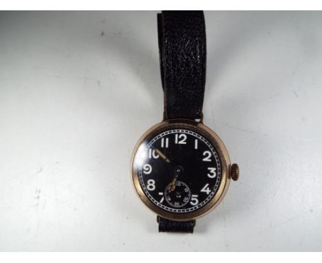 A gentleman's 9 carat rose gold cased wristwatch, assay marked for 1915, manual wind movement, black dial with white Arabic n