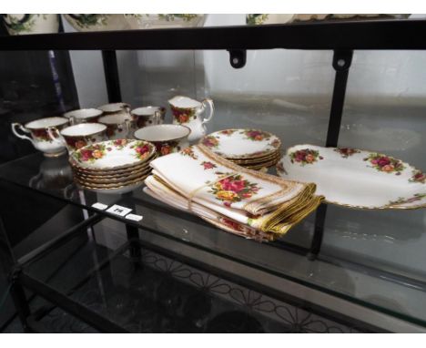 Twenty one pieces of Royal Albert Old Country Roses to include cups, plates, saucers, cream jug, sugar bowl and similar Est £