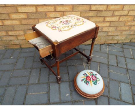 A Victorian music stool with drop down front and embroidered seat also included in the lot is a Victorian footstool with tape