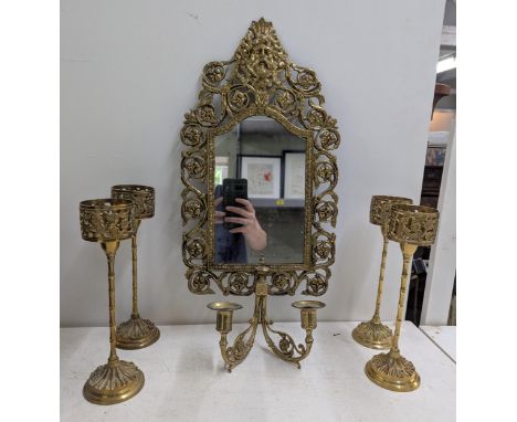 An Antique Brass girandole wall hanging mirror with ornate decoration along with four brass candlesticksLocation:If there is 