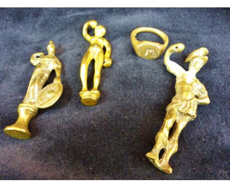Three brass seals in the form of soldiers and a seal ring.