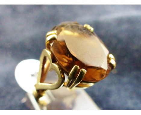 9 ct gold smoky quartz ring with heart shoulders. Size L.