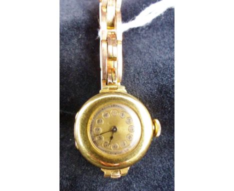 Vintage 18 ct gold ladies 1912 Rolex watch with signed Rolex 15 jewel movement on later 9 ct gold bracelet.