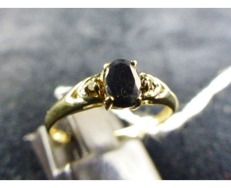 9 ct gold & sapphire ring. Size O.