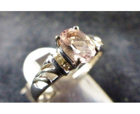 9 ct white gold solitaire ring with diamond set shoulders. Size O.