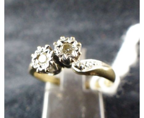 9 ct gold two diamond ring with diamond set shoulders. Size M.