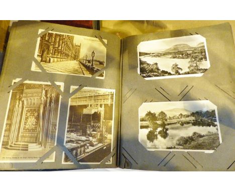 Album of predominately black and white vintage postcards, over 200 cards