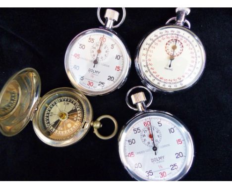 Three stopwatches and a compass.