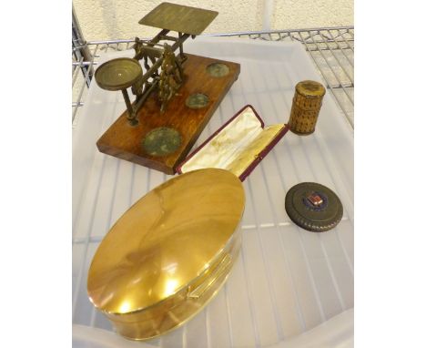 A tray of mixed items including postal scales.