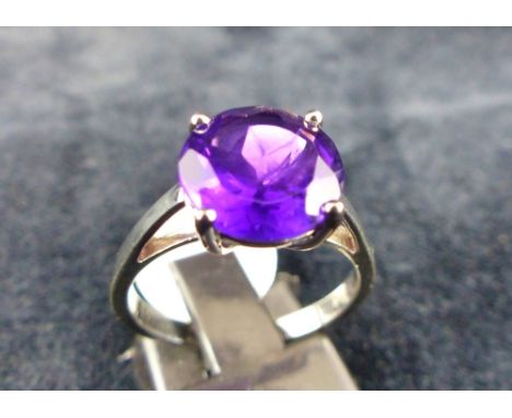 Purple stone Solitaire ring