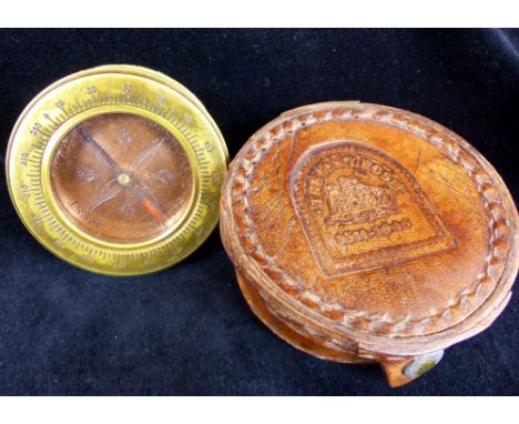 A leather cased brass compass stamped Mary Rose to case
