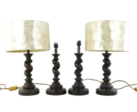 A pair of stained oak spiral turned lamps, with mother of pearl type shades 48cm's (inc shades), together with a pair of simi