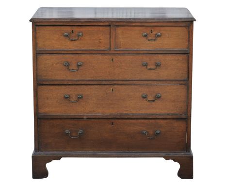 A George III oak chest of drawers, the mahogany banded top above two short and three long graduated drawers, on bracket feet,
