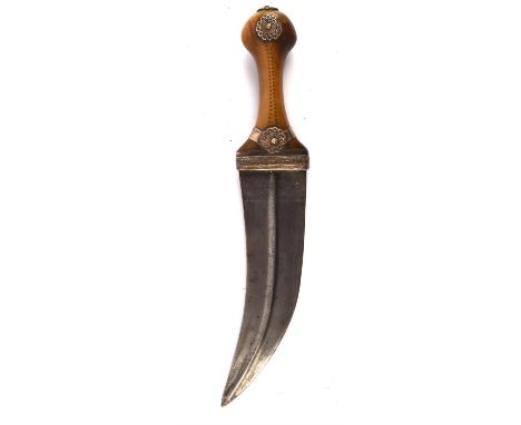 A late 19th / early 20th century Jambiya. the horn handle with white metal mounts, 19cm curved blade, (lacking scabbard) Note