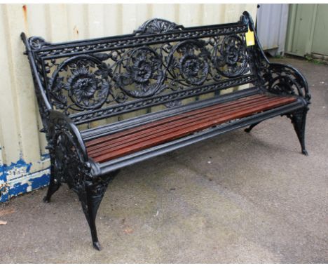 A late Victorian Coalbrookdale 'Horse Chestnut' cast iron bench, painted black with later wooden slats, 100cm high x 186cm wi
