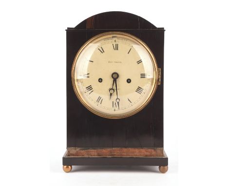 An early 19th century coromandel cased bracket clock by Recordon London.  The arch top case over a 6.5 inch white painted tin