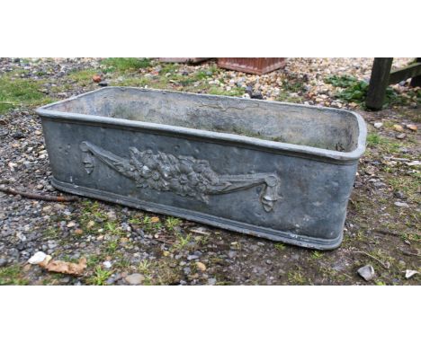 A lead planter decorated in classical style, 26 x 56cm