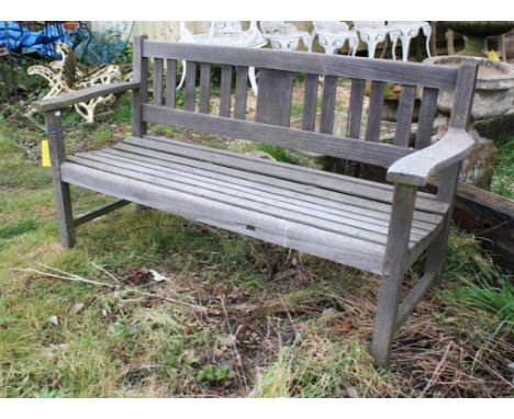A teak garden bench, with slatted seat and back, 85cm high x 152cm wide x 62cm deep