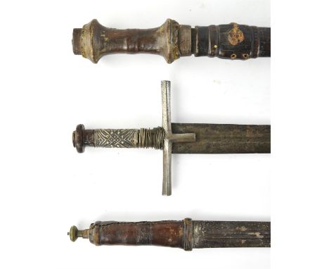 A Sudanese Broad Sword Kaskara, Late 19th Century, straight double edge blade, iron cross piece, grip partly covered with emb