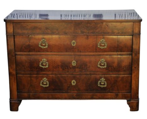A French walnut commode, mid 19th century, the later cleated top above an outset drawer and three flame veneered drawers, cor