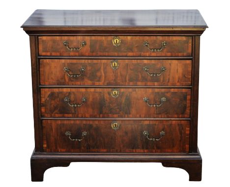 A William and Mary yew wood and oak chest of drawers, some later elements, the drawers with yew wood veneers and fruitwood ba
