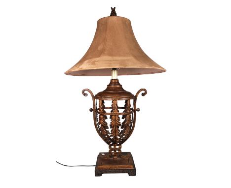 A patinated gilt metal table lamp, of leafy openwork vase form, on a square stepped plinth base, with shade, height overall, 