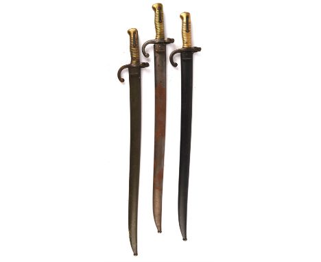 A French chassepot bayonet the spine engraved St. Etienne, August 1868. 57.5cm blade, with matching scabbard, another by Tull
