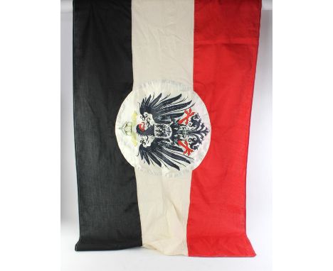 A WWI First World War Imperial German / Prussian Empire Colonial flag. Black, white and red tri-colour flat with a silk disc 